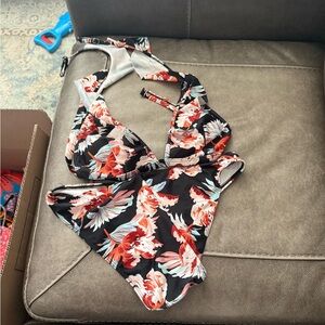 Beautiful flower two piece bathing suit. Worn only few times when was pregnant.